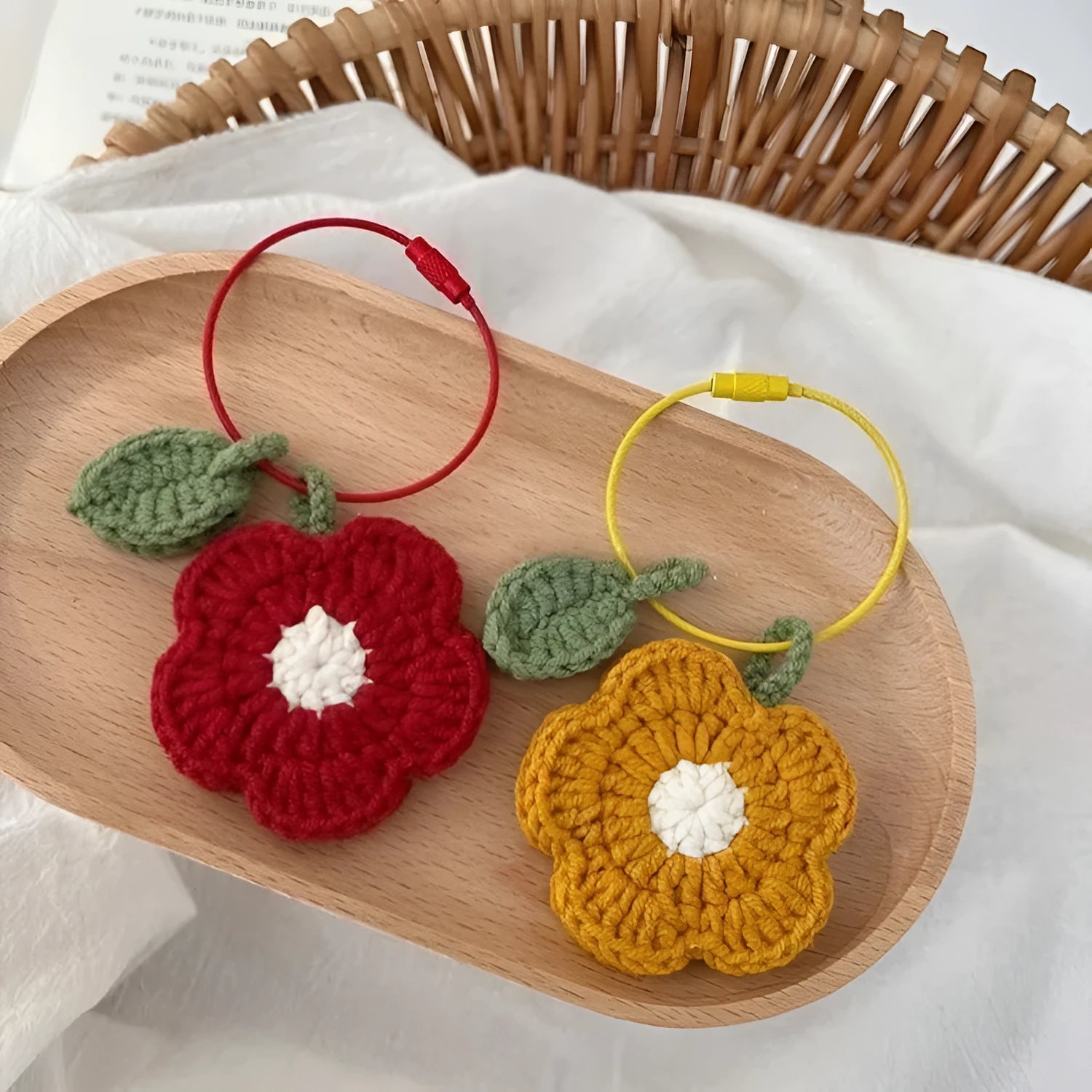Hand crocheted wool flower pendant in red or yellow plush wool designs