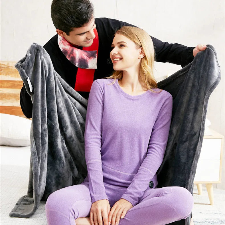 Dark grey USB electric heated plush blanket with round button zipper, shown folded.