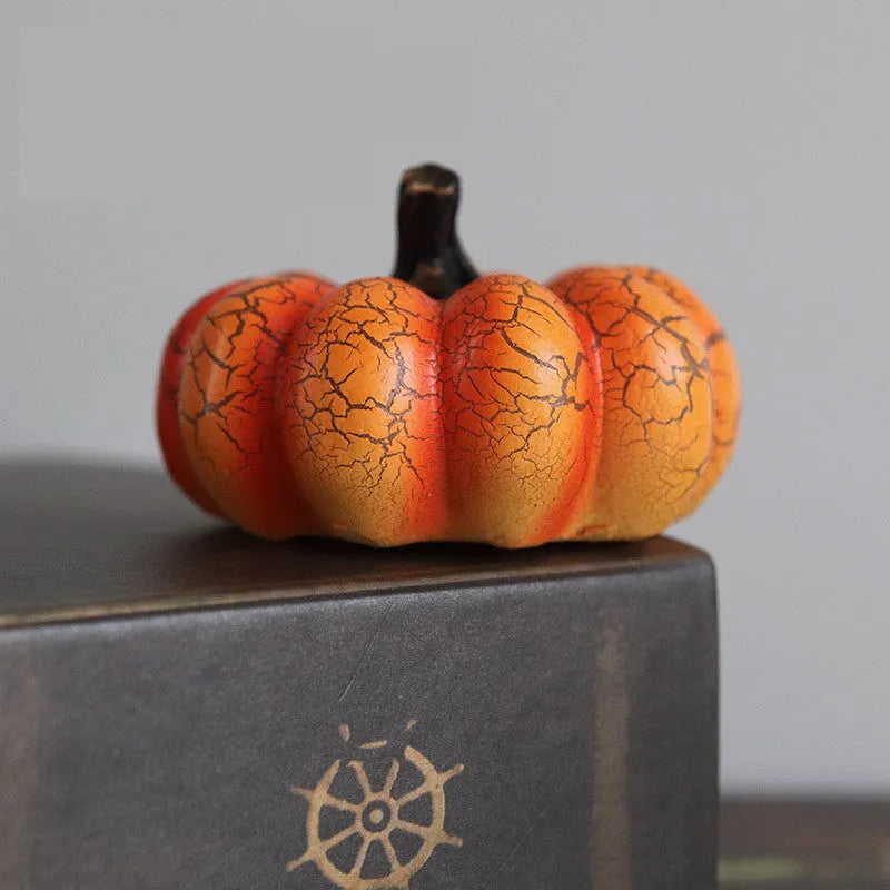 Set of three resin Halloween pumpkin lanterns with LED candle lights in short, medium, and long sizes.