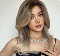 Mid-length synthetic wig with gradient colour and long curly style with bangs