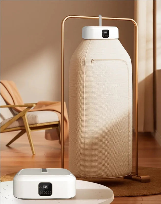White cylindrical compact laundry dryer with remote control, dimensions 29 × 22 × 10cm, foldable for storage