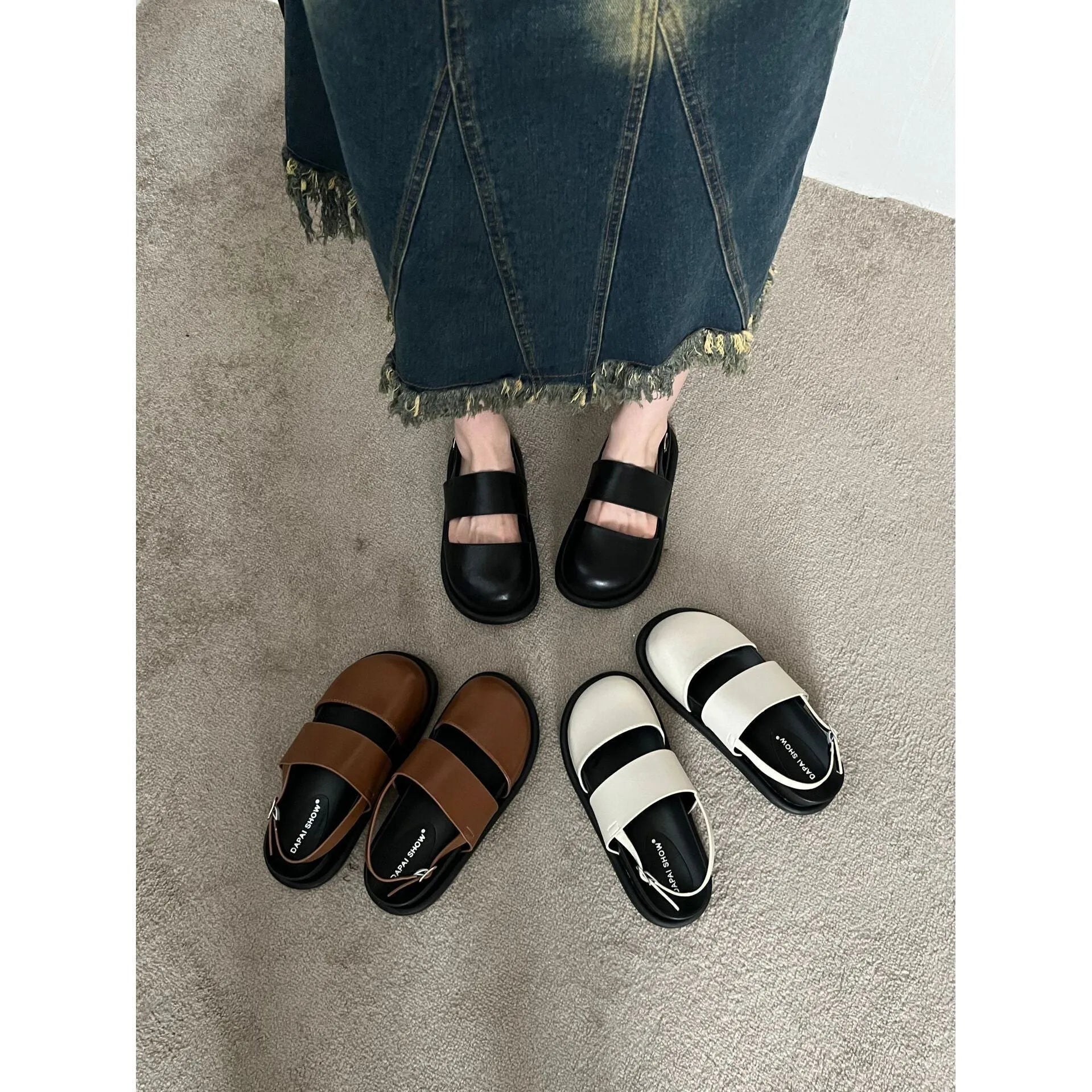 Retro raised sole sandals with ankle-strap buckle in black microfiber