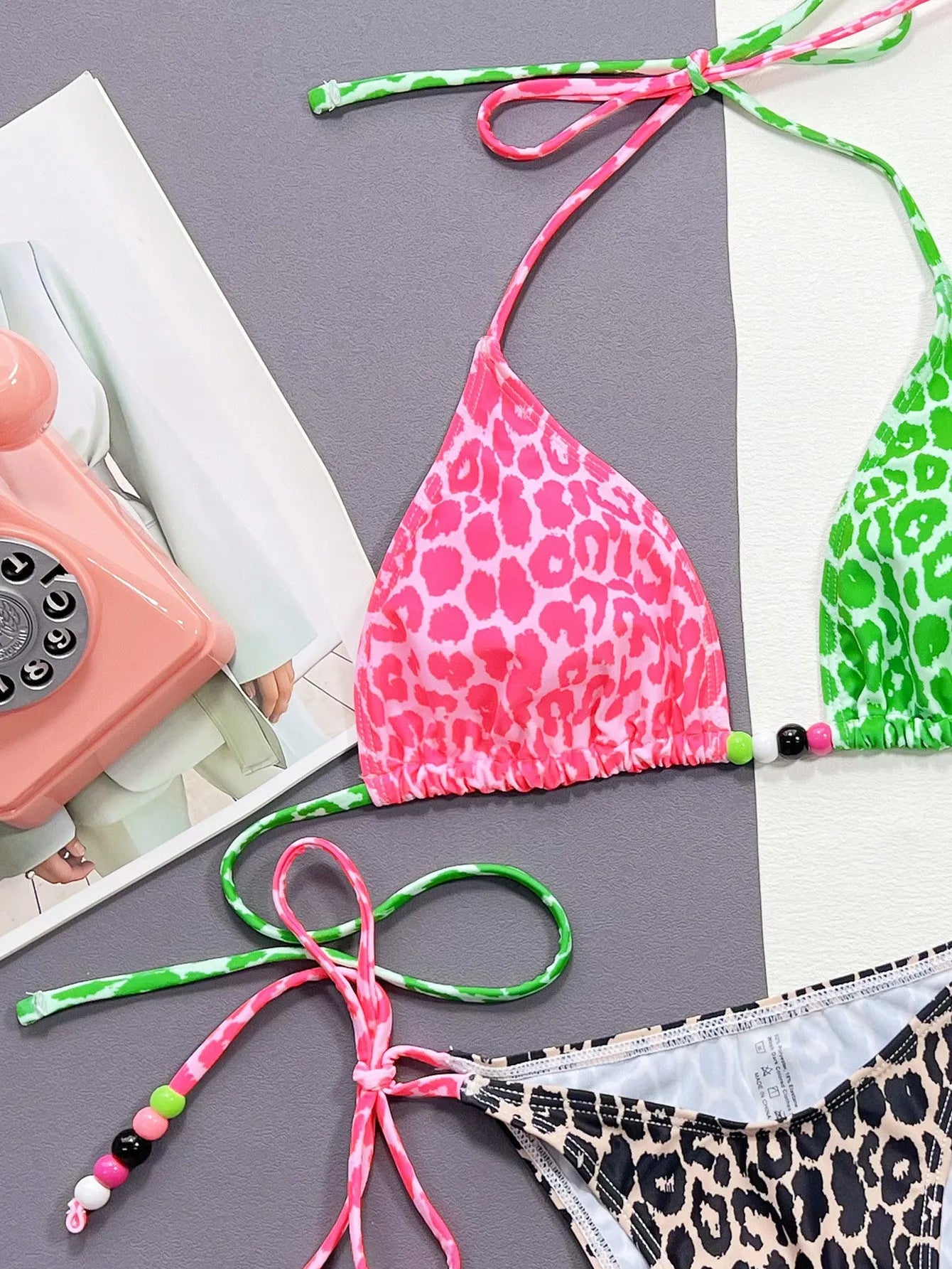 Women's leopard print bikini swimsuit showing bra and brief set with polyester and spandex construction