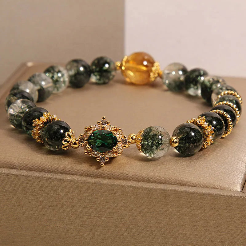 Women's gold rutilated quartz crystal bracelet with green phantom quartz beads and pearl rhinestone accents
