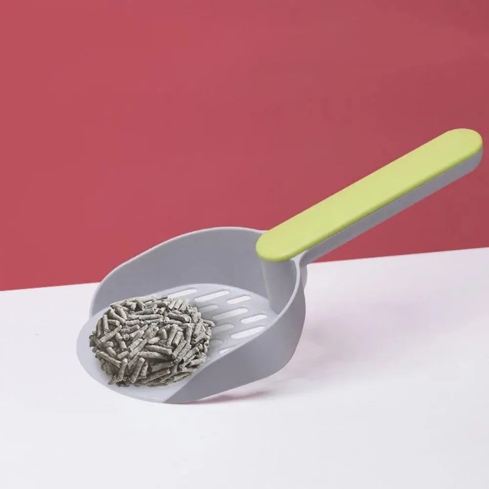 Blue plastic cat litter shovel scoop tool for cleaning litter boxes.