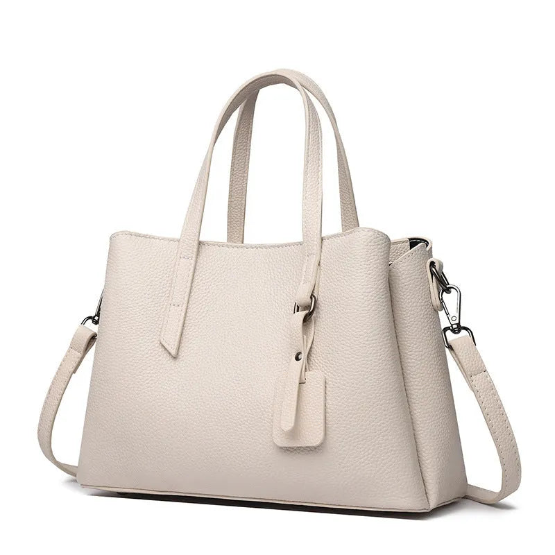 Women's cowhide leather shoulder handbag in horizontal square shape with contrast colour details and single strap