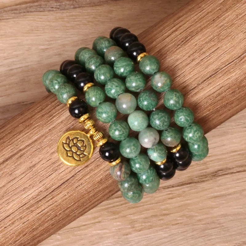 Green and black elastic beaded long bracelet with alloy material and adjustable sizing