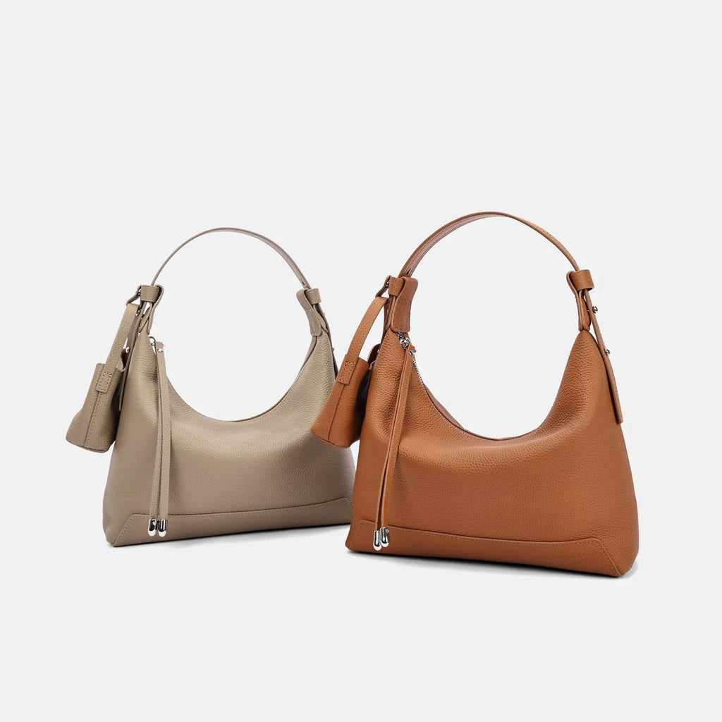 Simple grey genuine cowhide leather women's shoulder bag with visible stitching, shown on a neutral background.