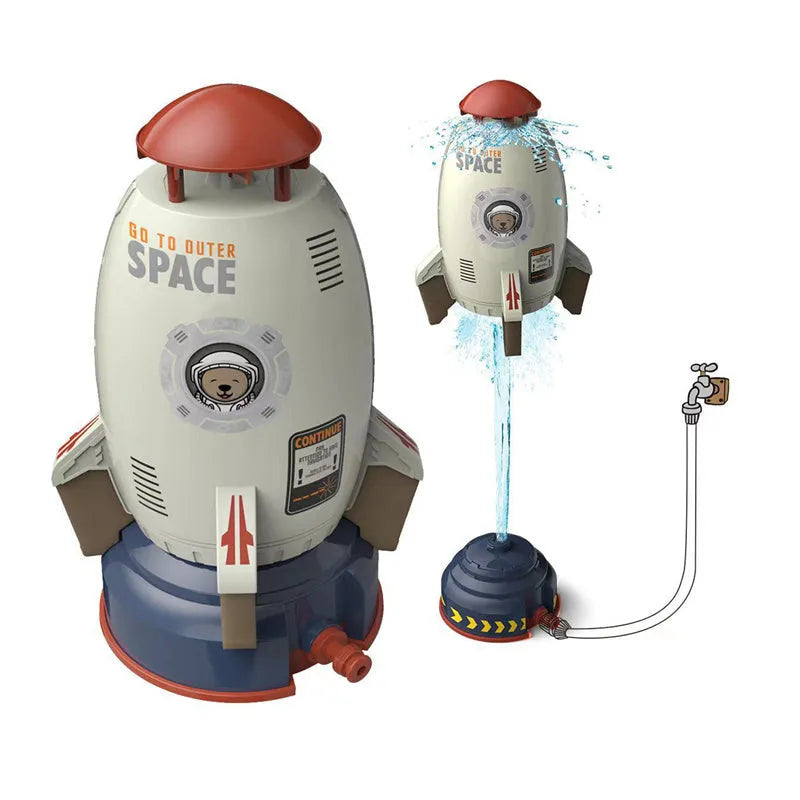 Yellow water pressure rocket launcher toy for kids outdoor garden play on a green lawn.