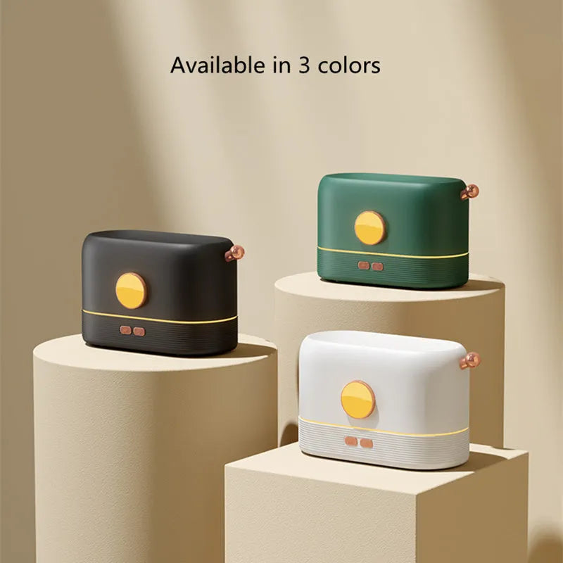 Black USB humidifier with flame simulation effect on wooden desk, showing mist output and compact 15cm height