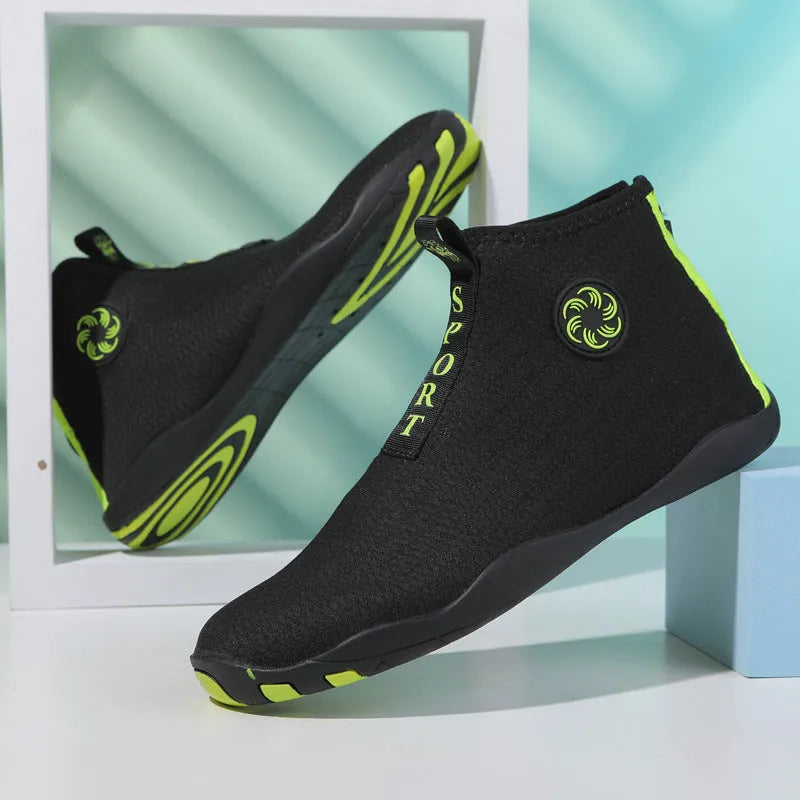 Outdoor beach shoes in black and fluorescent green with mesh upper and rubber sole.