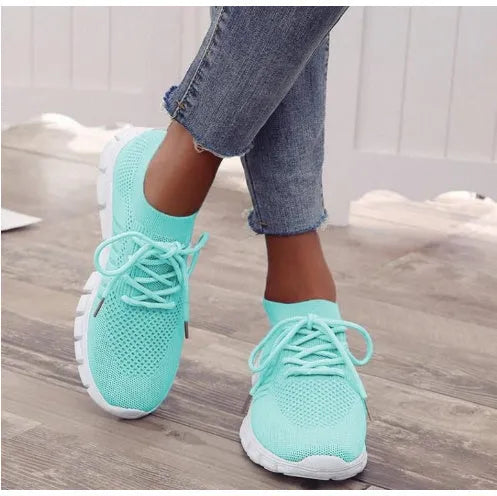Women's breathable platform sneakers in multiple colours on a white background, showing lace-up front and flat rubber sole.