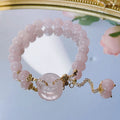 Women's pink crystal bracelet with peace buckle safety closure on wrist