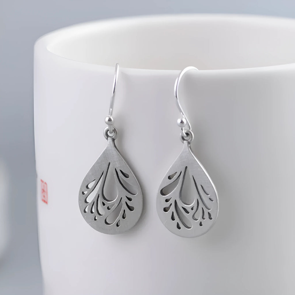 Pair of silver retro hollow water drop earrings with a hand-ground finish.