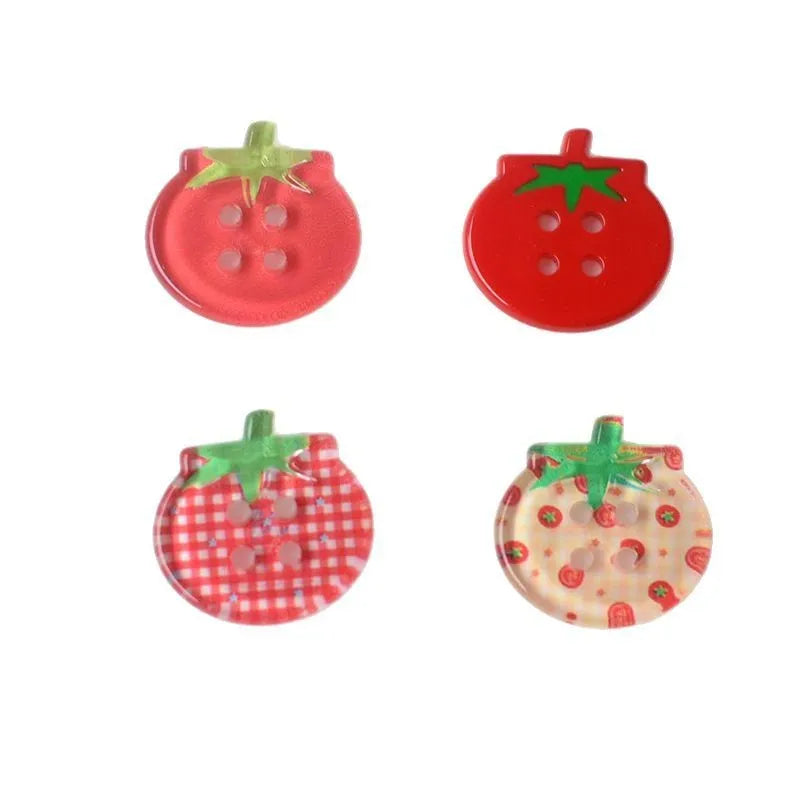 Medium size red tomato pattern button ornaments made from plastic resin, shown in different colour variations.