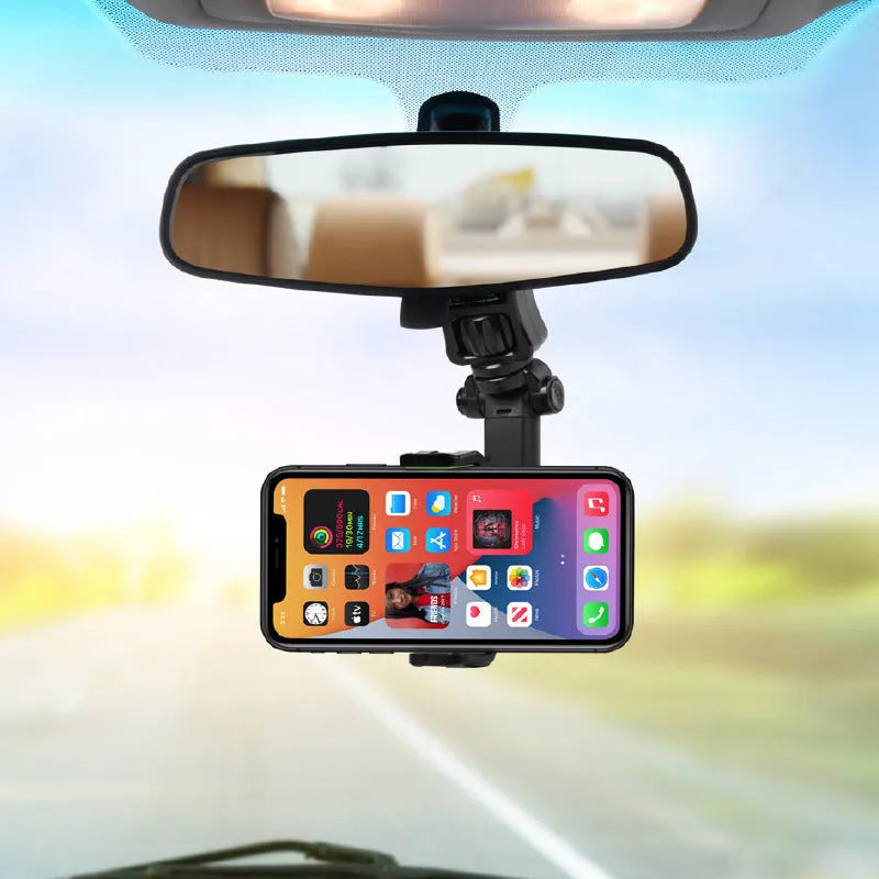 Black and green car phone holder attached to rear view mirror bracket