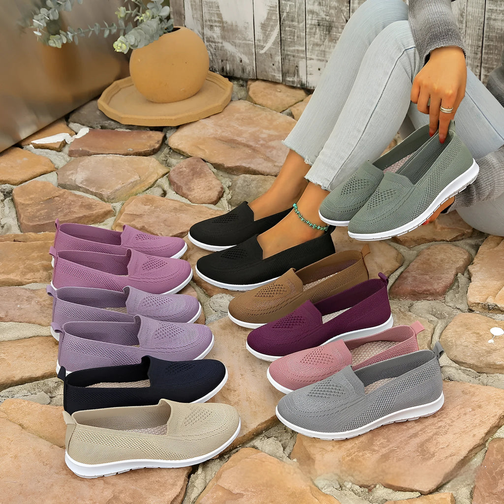 Women's plus size beige slip-on cloth shoes with low-cut design and flat sole.