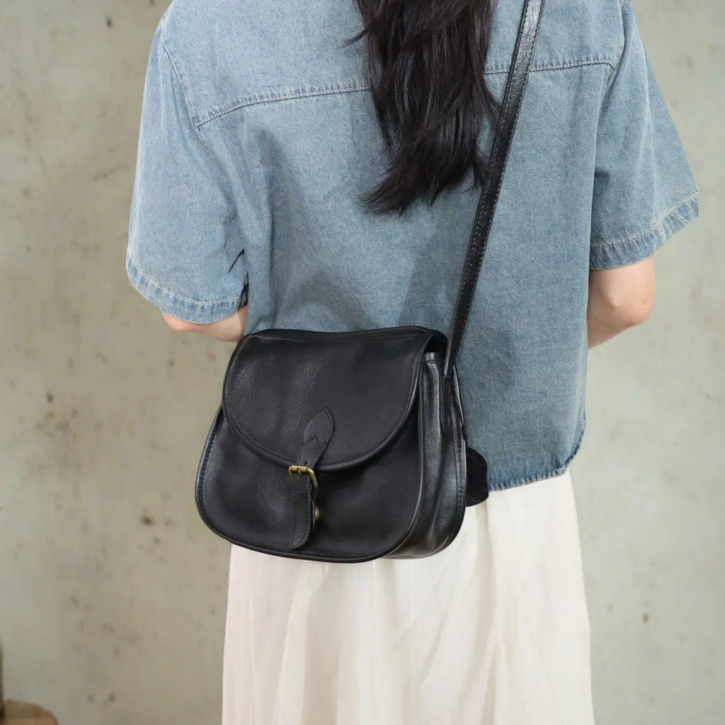 Brown retro-style genuine leather messenger bag with flap closure and crossbody strap
