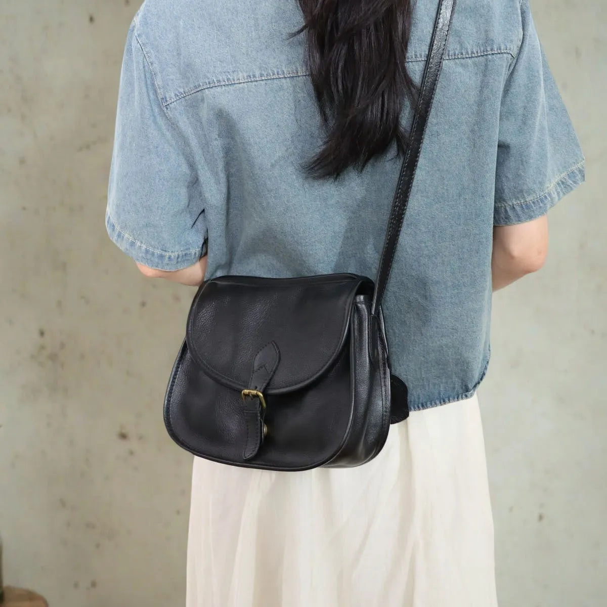 Brown retro-style genuine leather messenger bag with flap closure and crossbody strap