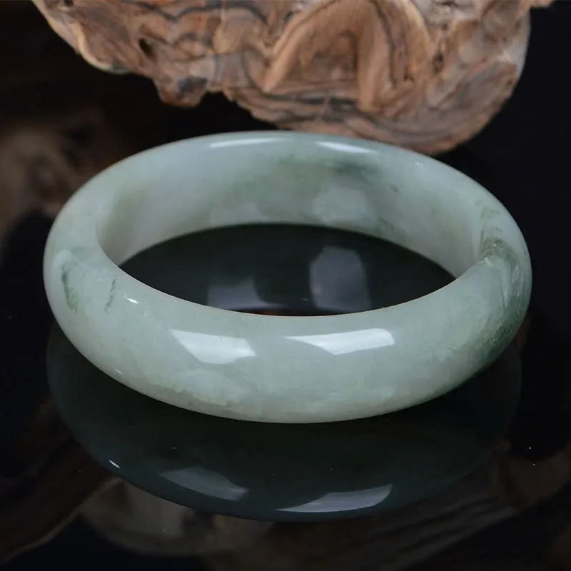 Natural Jinsi Jade Chinese-style bracelet shown in various sizes from 52mm to 62mm inner diameter.