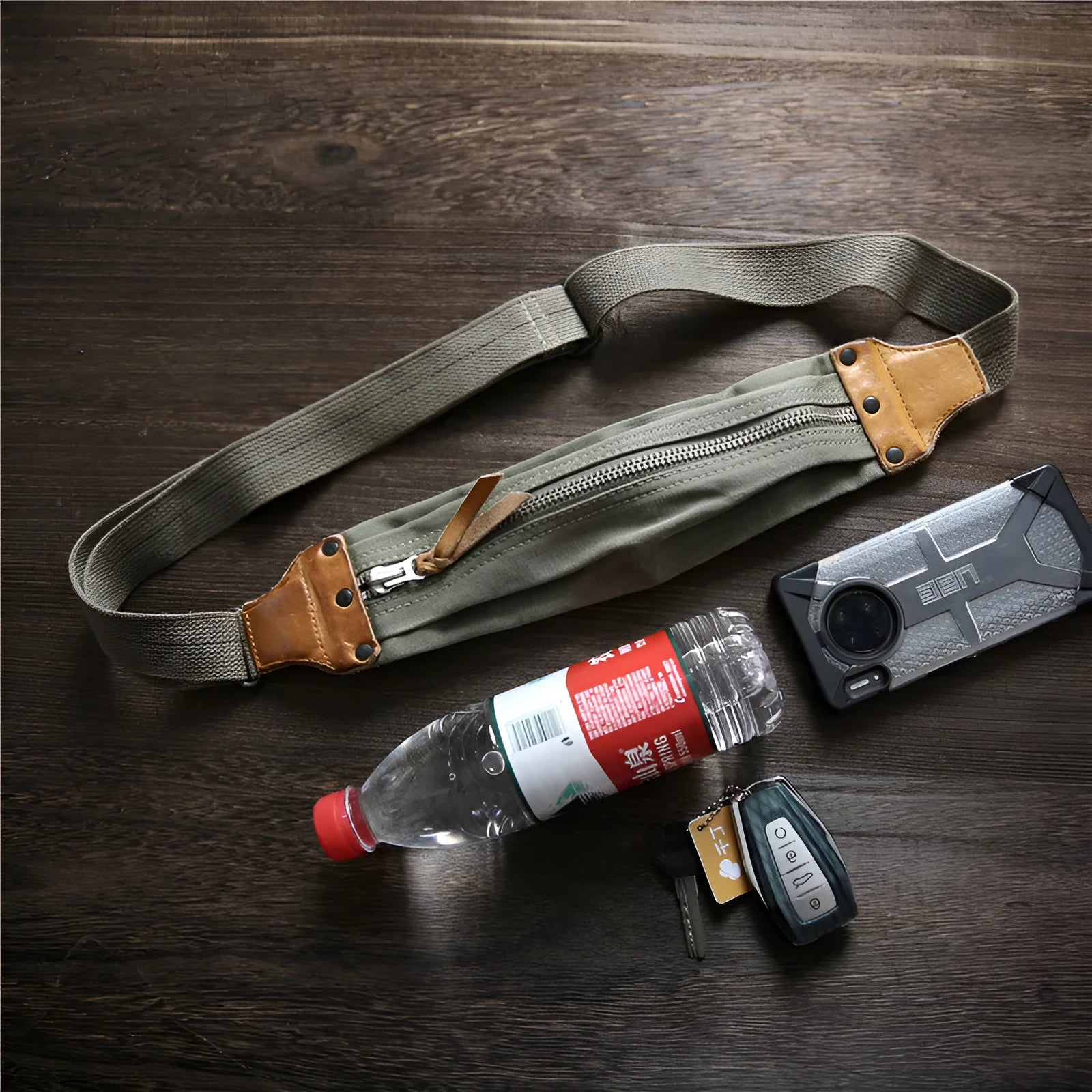 Green military style chest bag made from vintage canvas with cowhide leather accents and anti-theft design