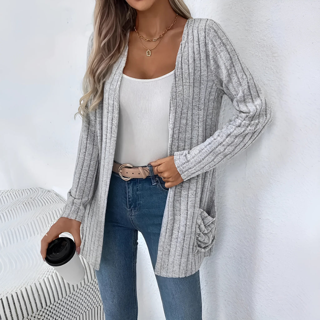 Solid colour long sleeve cardigan knitwear with two pockets, shown in granny grey.