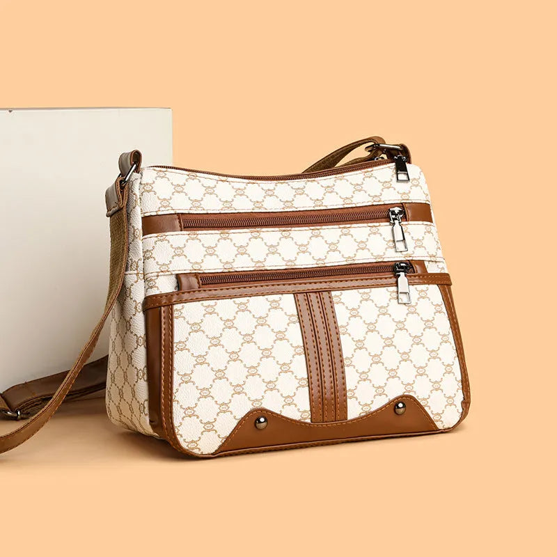 Brown women's crossbody bag with stitching pattern and shoulder strap