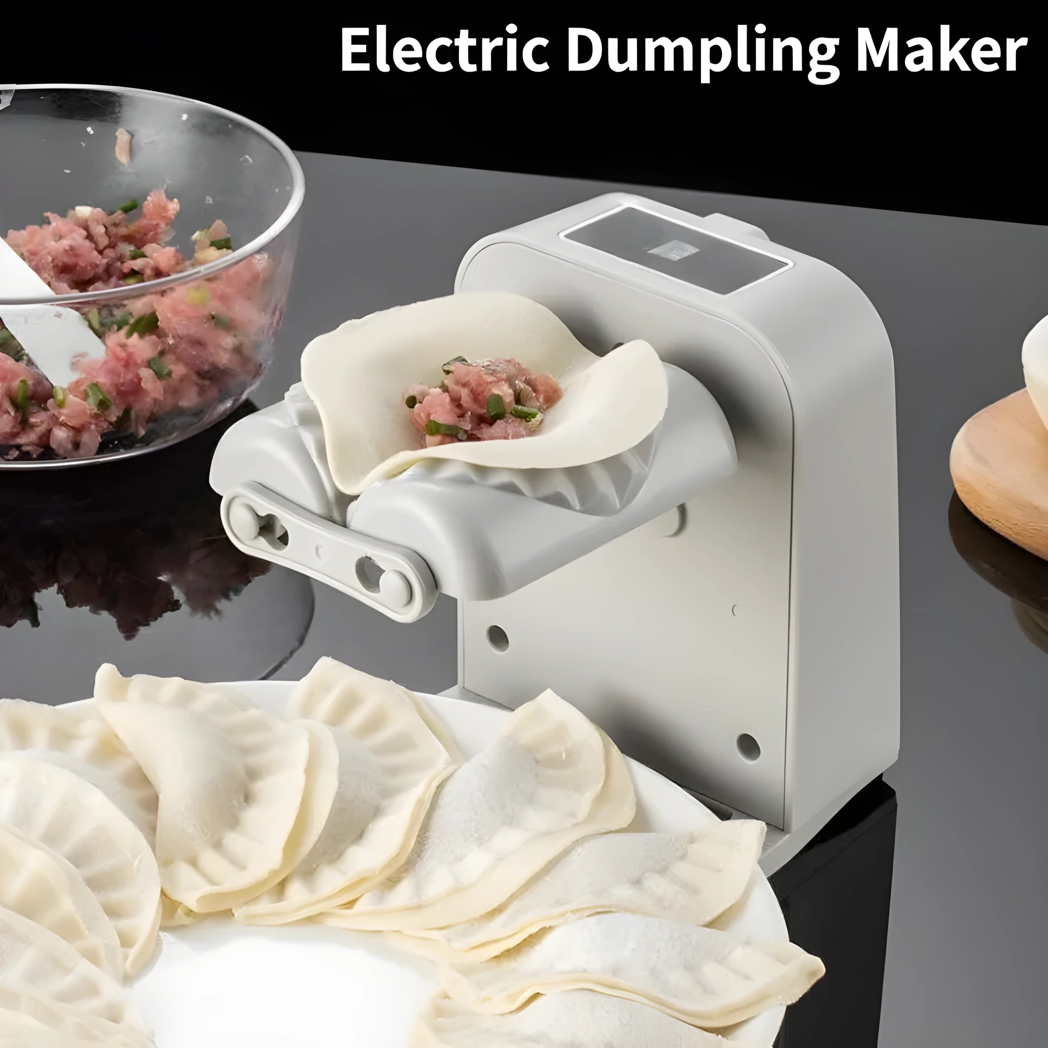 White electric dumpling maker machine with USB charging cable, brush, and spoon.