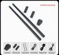 Black wireless air drum kit with drumsticks and foam floor markers for virtual reality music creation