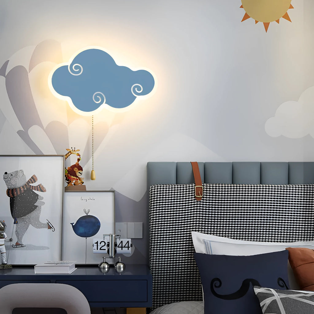 Modern white cloud-shaped children's wall lamp with acrylic shade mounted on a blue wall.