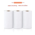 Three rolls of white 57mm thermal paper for portable printers on a blue background.