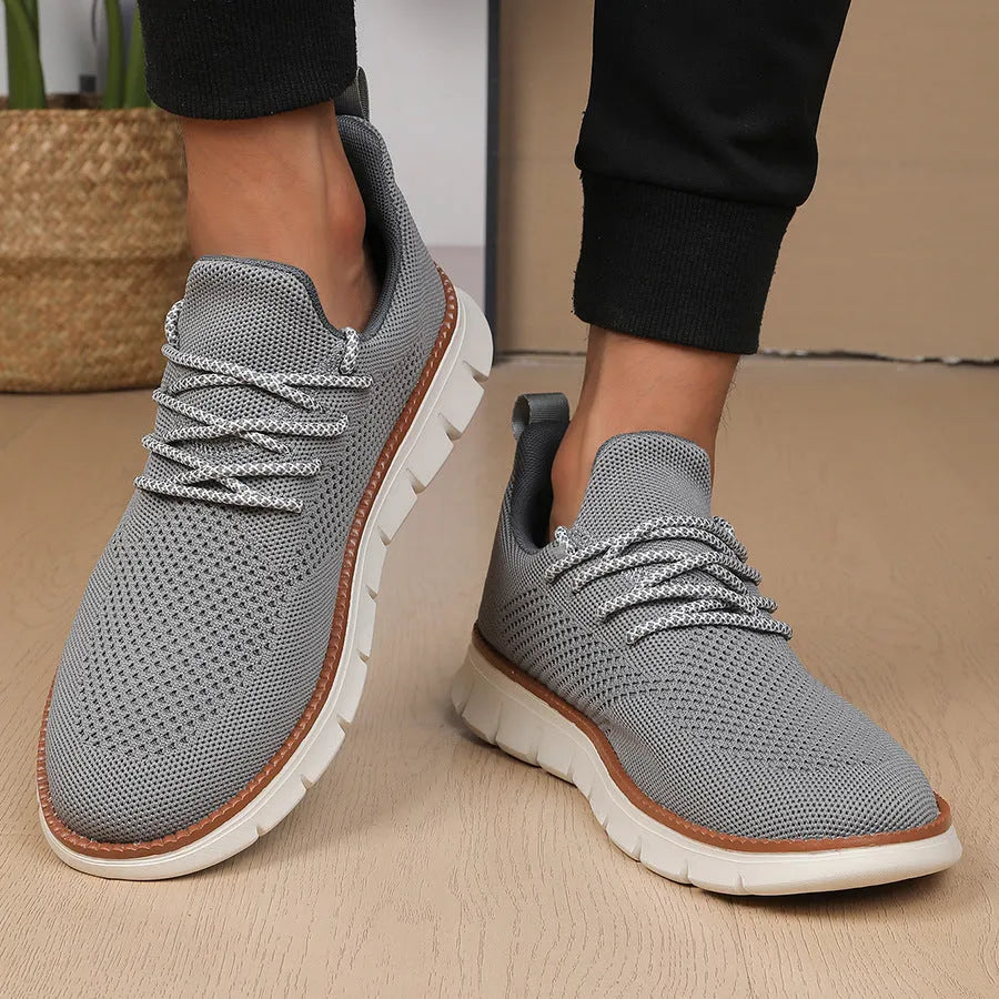 Men's grey and black fly woven mesh sneakers with round toe and low-heel design