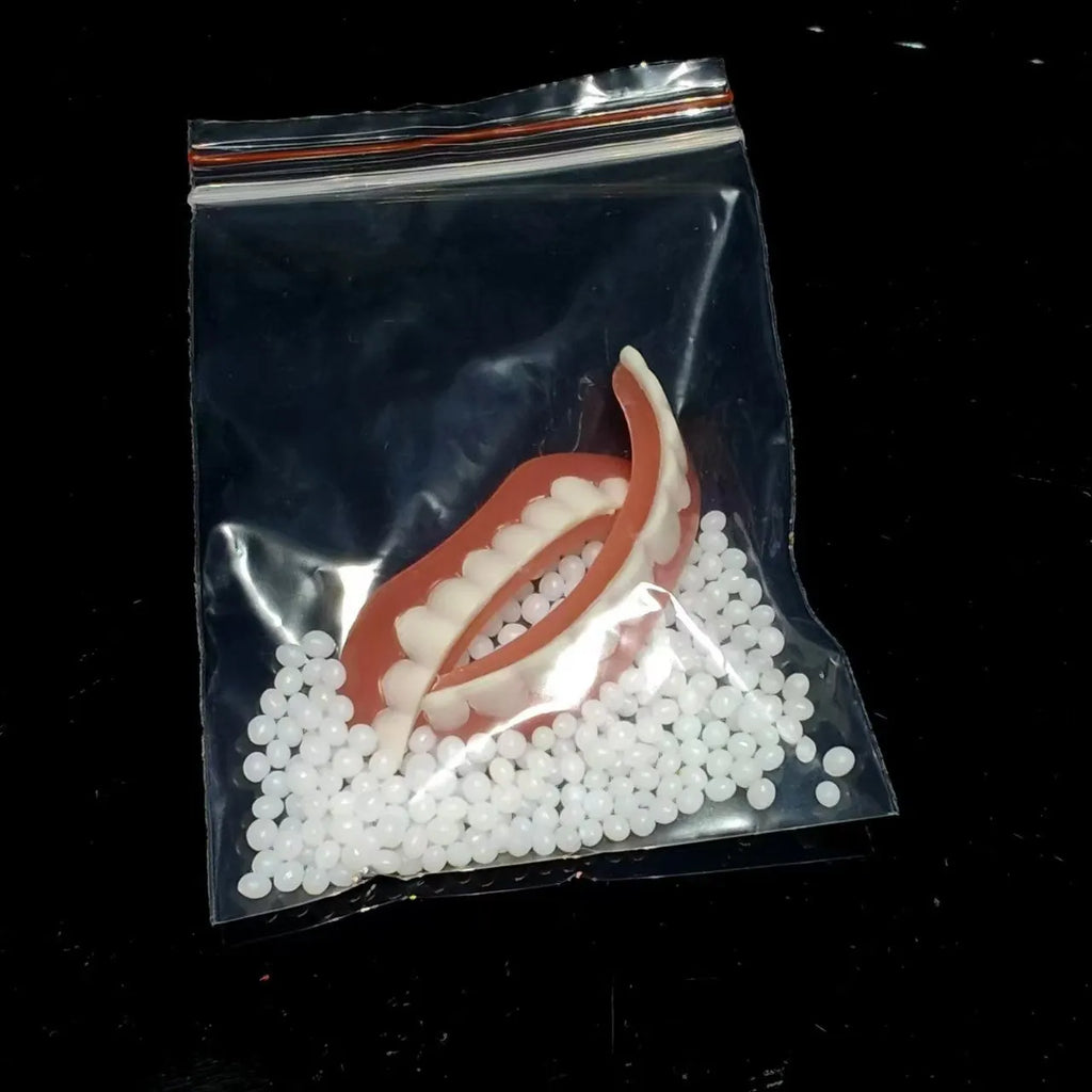 Silicone simulation dentures showing upper and lower teeth in natural colour for dental training