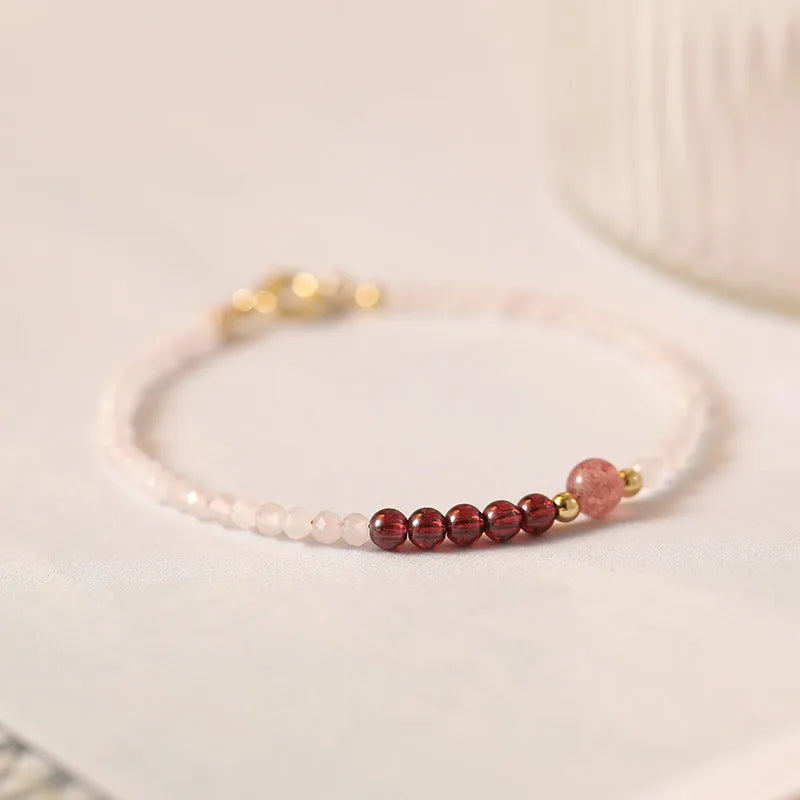 Handmade pink crystal and strawberry quartz bracelet with animal zodiac charm
