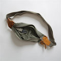 Green military style chest bag made from vintage canvas with cowhide leather accents and anti-theft design