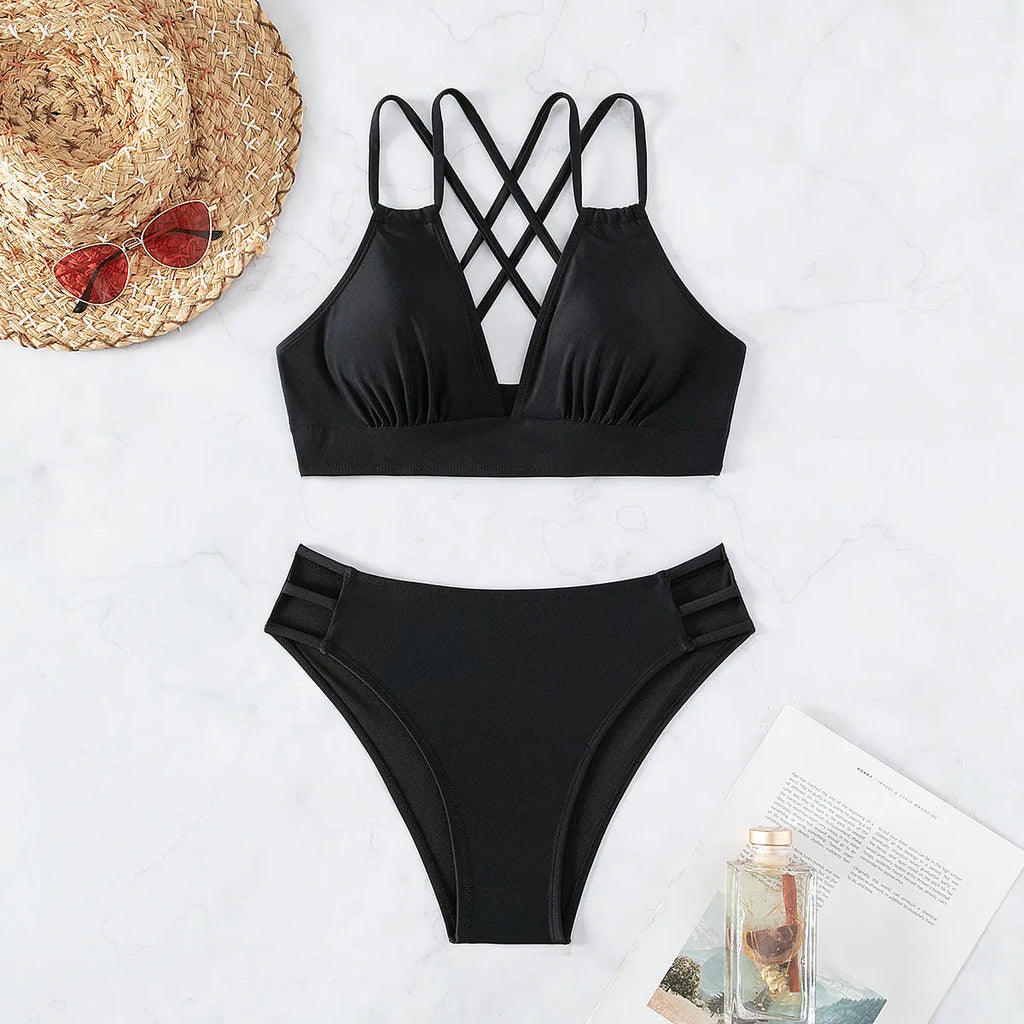 Women's black V-neck halter bikini set on a mannequin, showing adjustable straps and separate bra and shorts design.