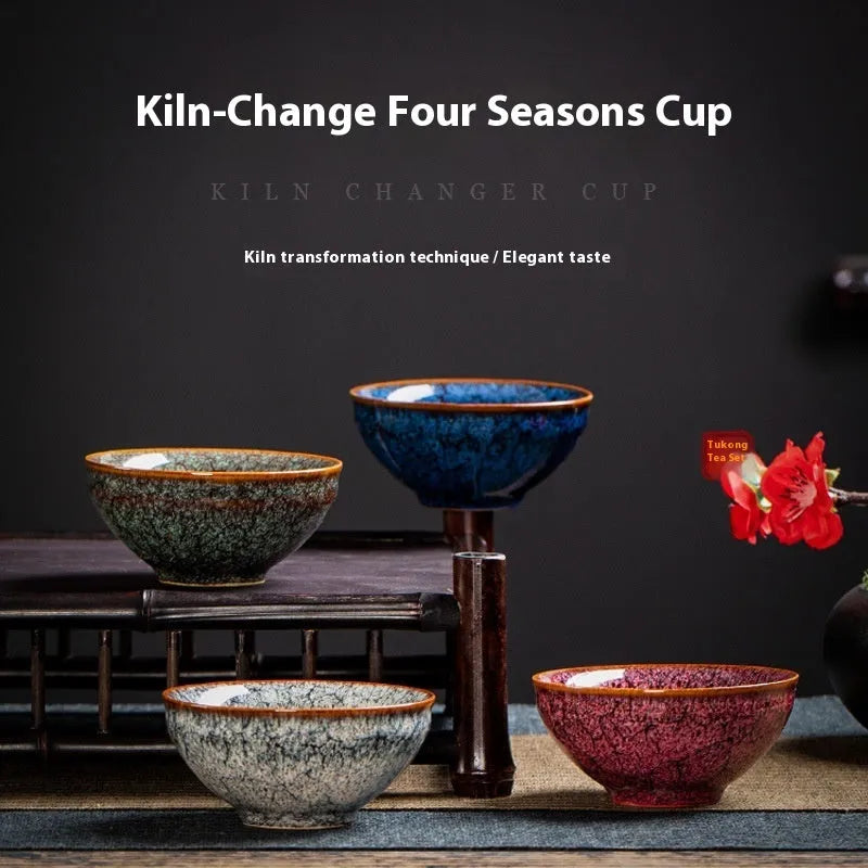 Four ceramic Gongfu tea cups in a light-coloured gift box, new Chinese style.