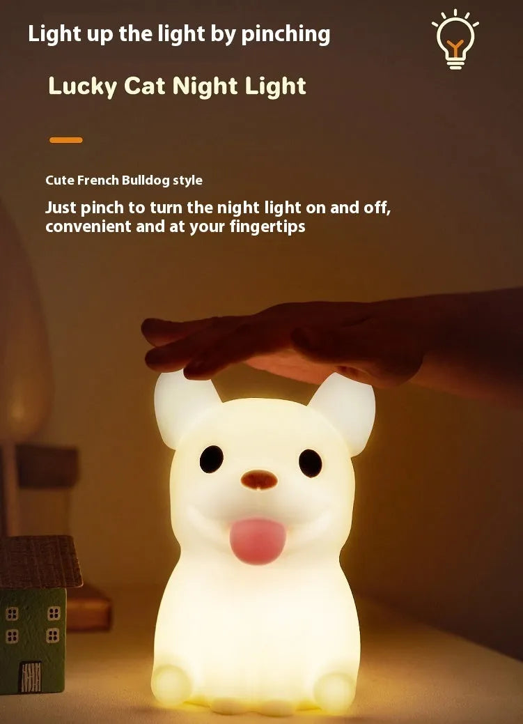 Silicone cartoon bull night light with USB port for charging and dimming controls.