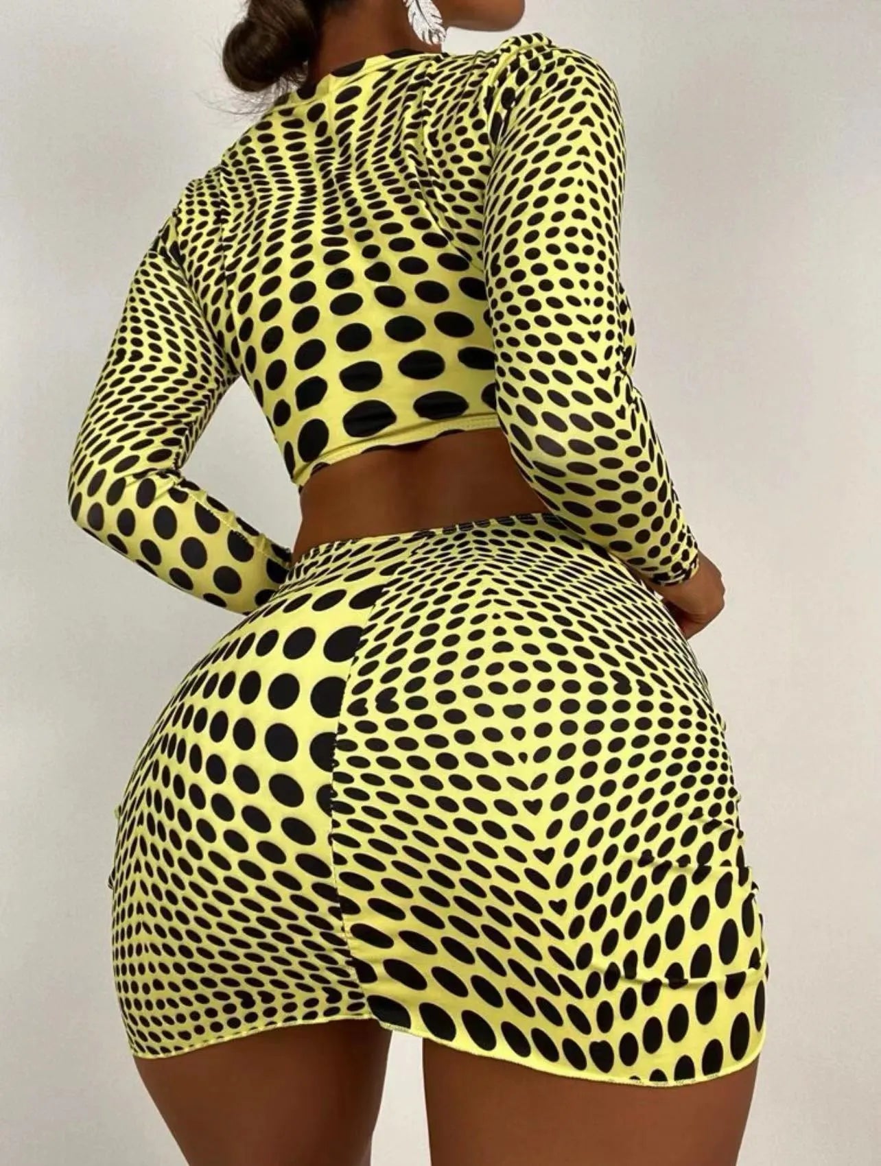 Women's green polka dot three-piece swimsuit set showing top, skirt and bra