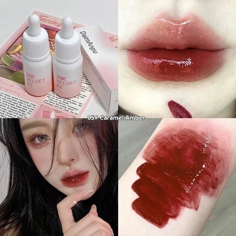 Mirror Lip Lacquer moisturising lip gloss tube in sheer shades on a plain background.