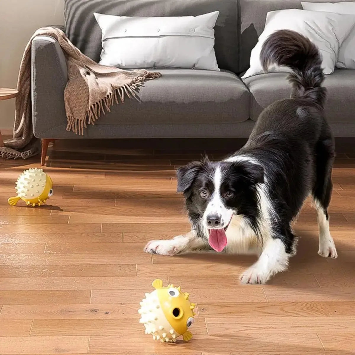 Yellow fish-shaped dog chew toy with textured surface and squeaker, measuring 20cm long