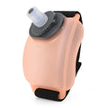 Orange silicone wrist water bottle with Velcro strap, shown worn on wrist for running.