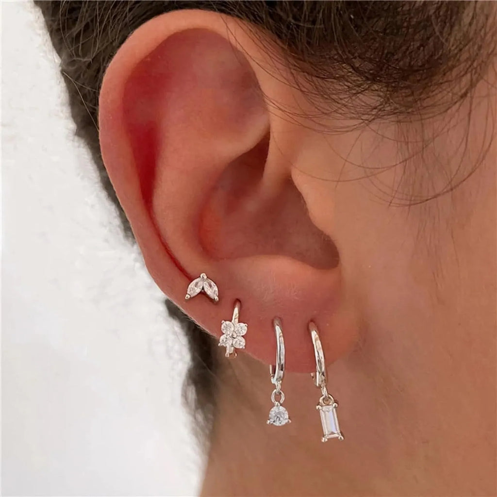 Copper geometric earrings set with electroplated gold finish showing star, ellipse, ring, and quadrilateral designs