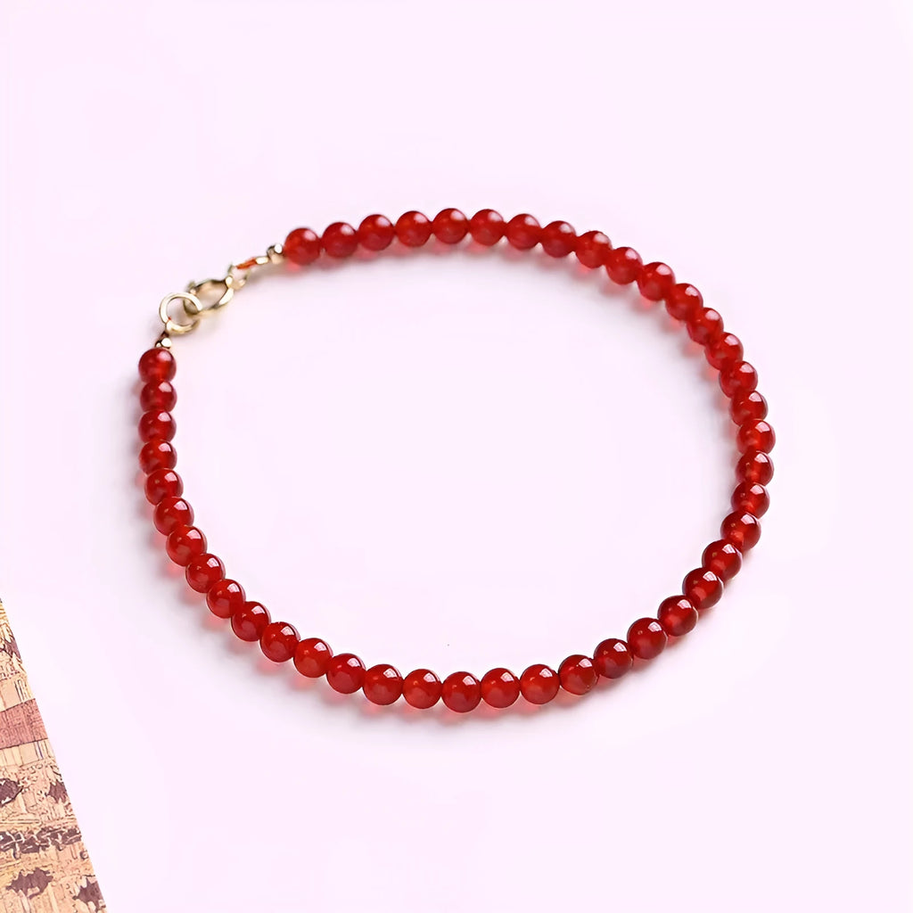 A red agate bracelet for women with an ultra-thin, delicate design on a wrist.