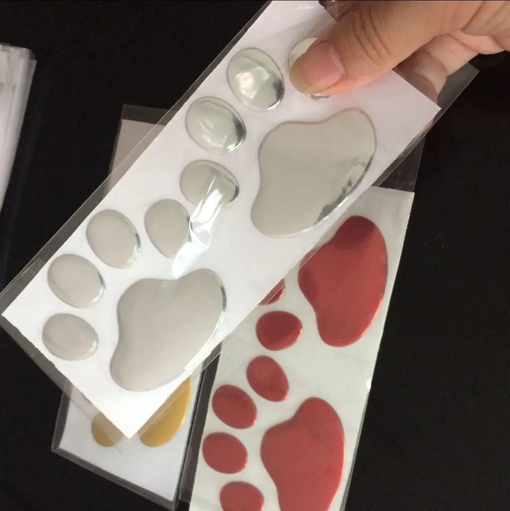 PVC hand-shaped brush car sticker with dog footprints pattern measuring 7cm length in four colour options