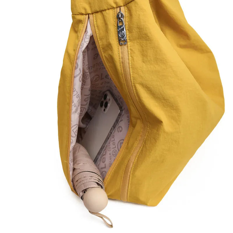 Heart-shaped nylon underarm bag for women in black, blue, khaki, or yellow, showing large capacity and soft design