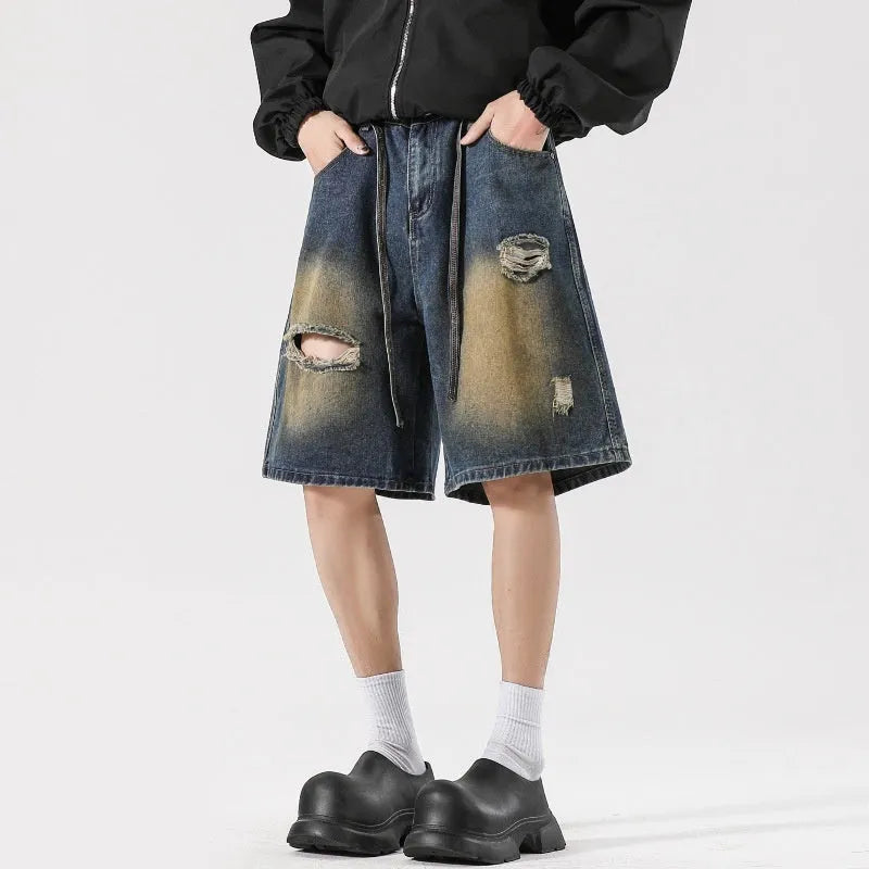 Loose fit retro blue distressed jeans on man showing cotton denim construction and street style detailing