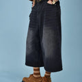 Men's straight leg denim shorts in blue, shown on a model, featuring a fifth pants length and micro-elastic fabric.