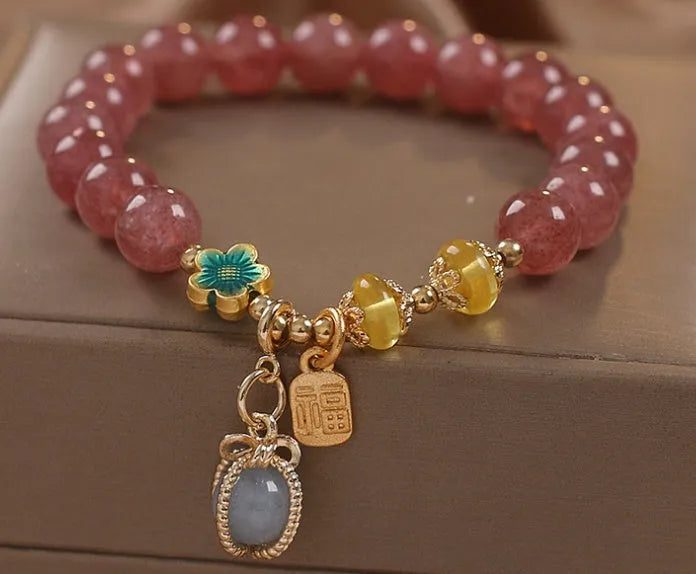 Red strawberry quartz beaded bracelet with alloy setting and rhinestone decoration