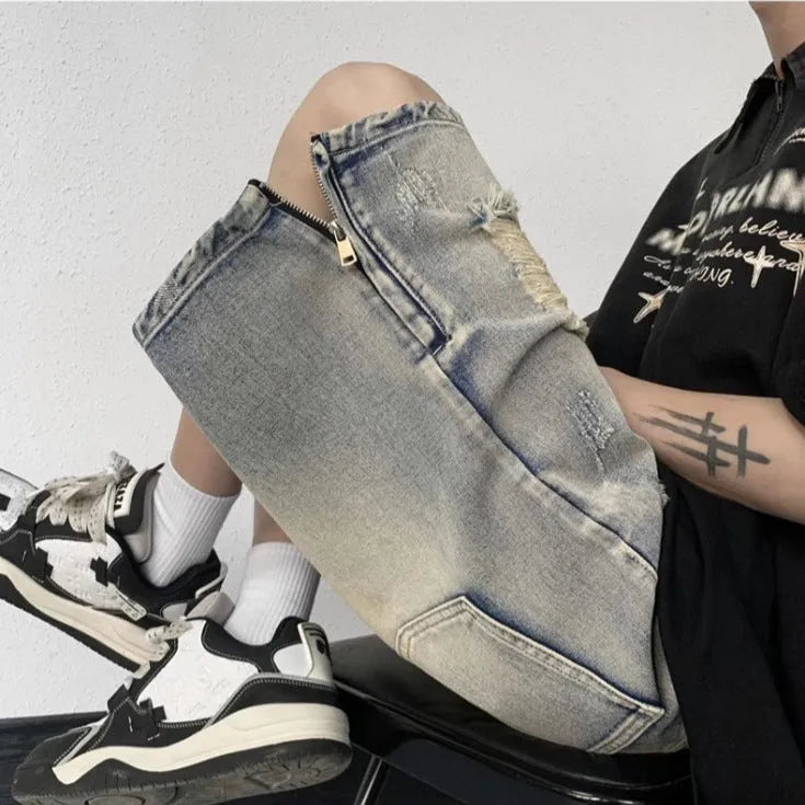 Blue retro tattered denim shorts with a wide leg loose fit on a neutral background.